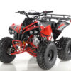 A red and black atv is on the floor