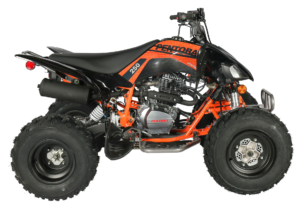 A black and orange atv is parked on the ground.