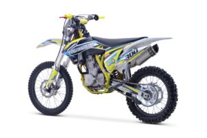 A dirt bike is shown with the seat down.