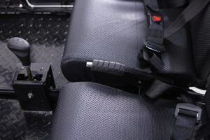 A seat belt is shown on the back of a car.
