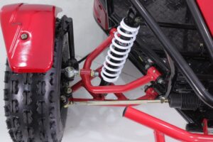 A red and black atv with a white shock absorber.