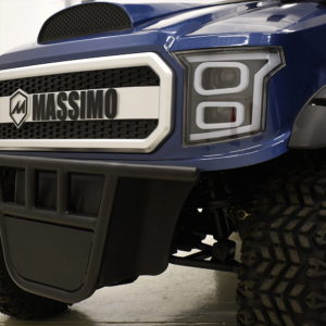 A close up of the front end of a blue truck.