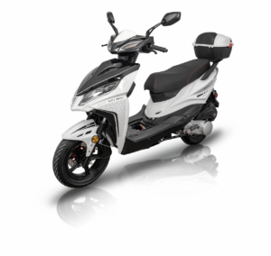 A white scooter with black accents is parked on the floor.