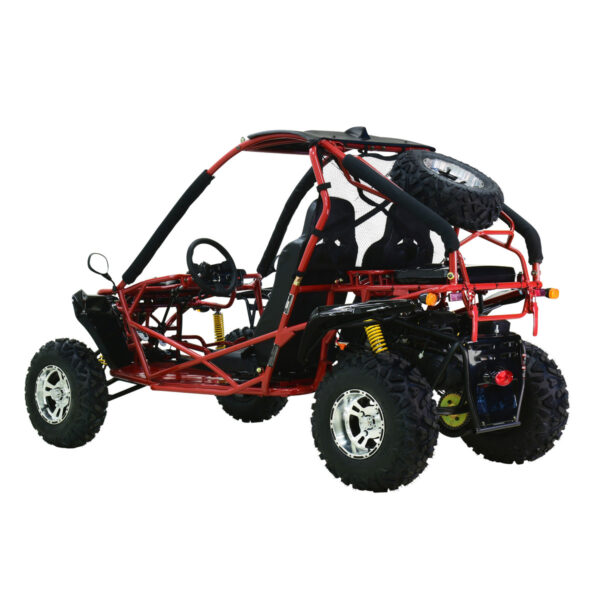 A red and black go kart is parked on the ground.