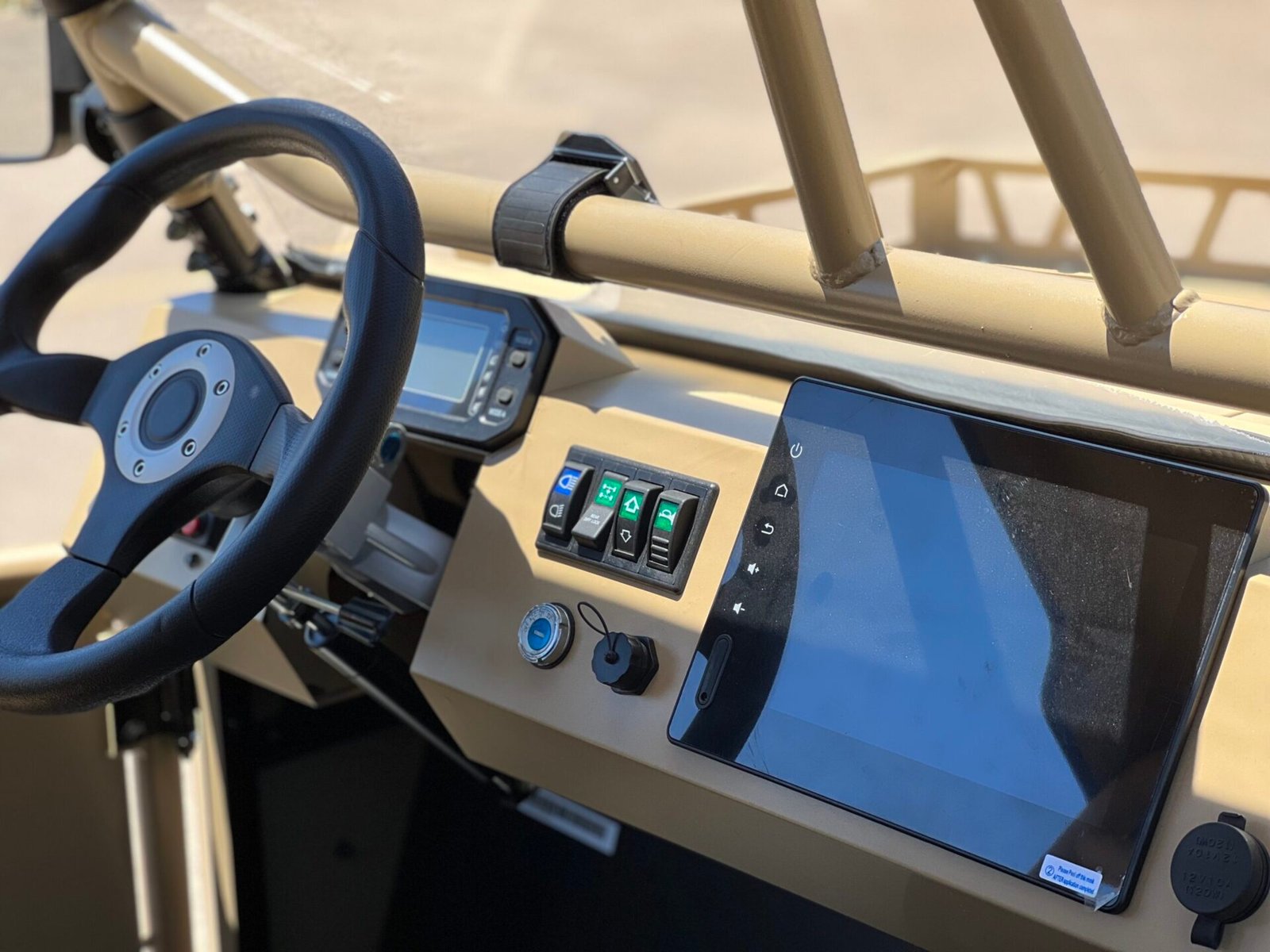 A dashboard with a tablet and phone on it.