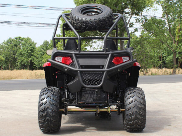 A black and red four wheeler parked on the side of road.