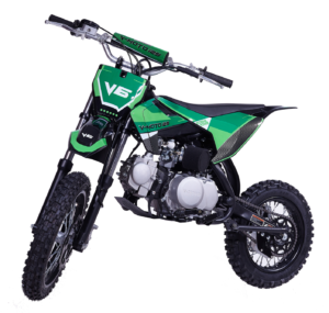 A green dirt bike is parked on the ground.