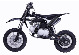 A black dirt bike is parked on the ground