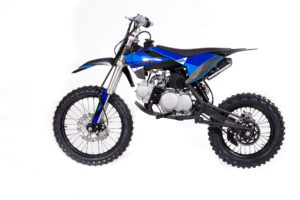 A blue dirt bike is parked on the ground
