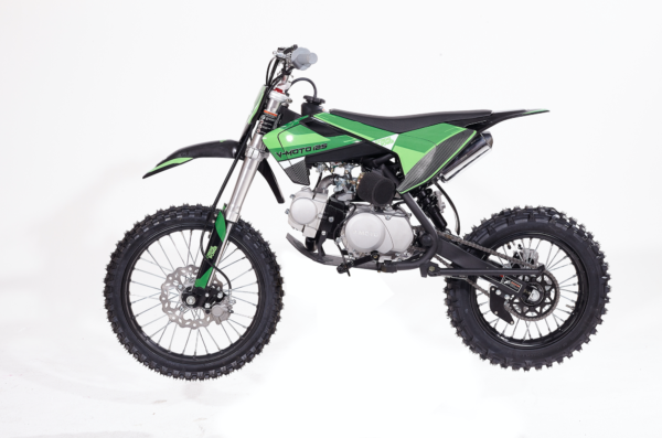 A green dirt bike is parked on the ground