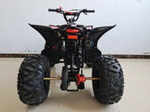 A black and red atv parked in a garage.