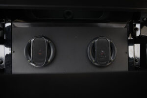 A close up of the two buttons on an oven.