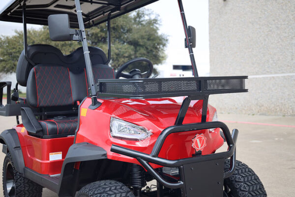 A red golf cart with a black handle and seat.