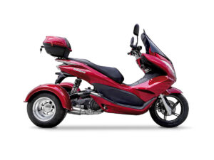 A red three wheeled motorcycle with a black seat.