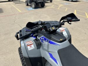 A close up of the handlebars on an atv.