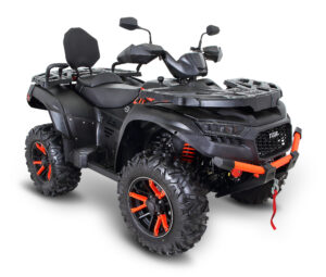 A black and red atv is parked on the ground