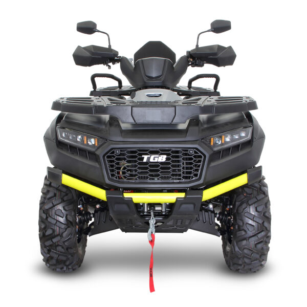 A black and yellow atv with a red handle.