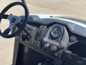 A close up of the dashboard and controls on a vehicle.