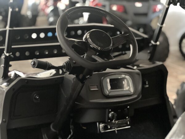 A steering wheel and controls of an automobile.