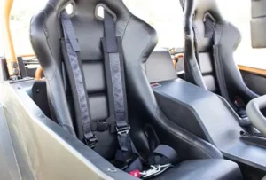 A car seat with two black seats and one white seat.