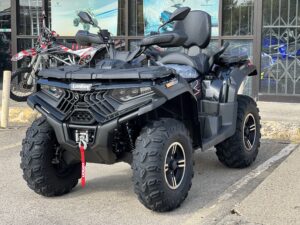 A black four-wheeler parked in the street.