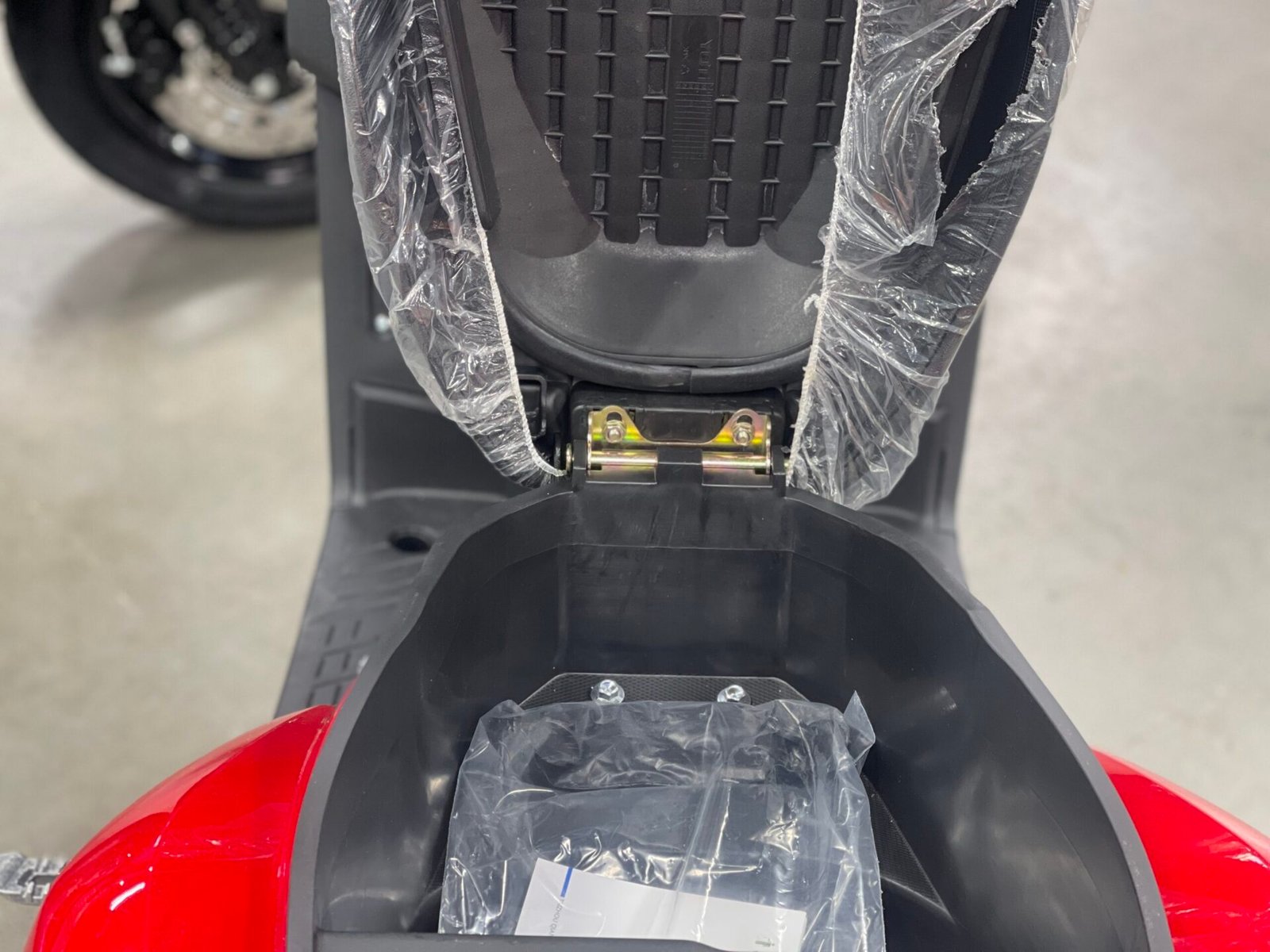 A seat in the back of a motorcycle.