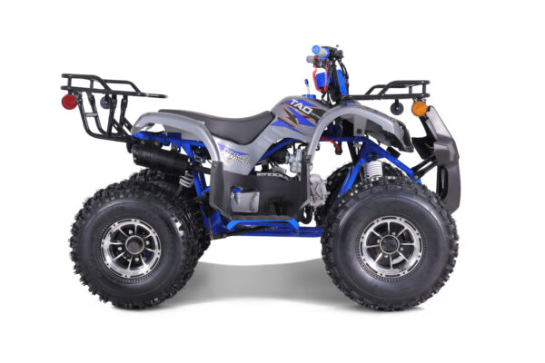 A blue and silver atv with big tires