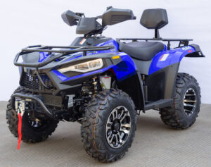 A blue atv with black wheels and a seat.