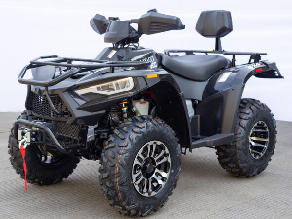 A black four wheeler with two seats on the back.
