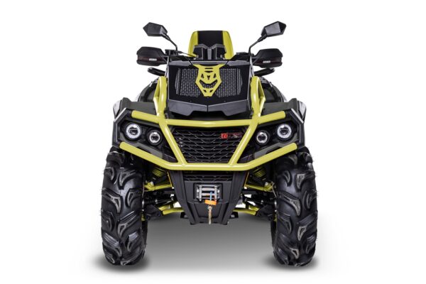 A yellow and black atv with lights on the front.