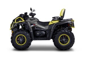 A yellow and black four wheeler is parked on the ground
