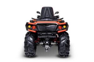 A red and black four wheeler is shown from the front.