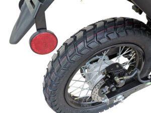 A close up of the rear tire on a motorcycle